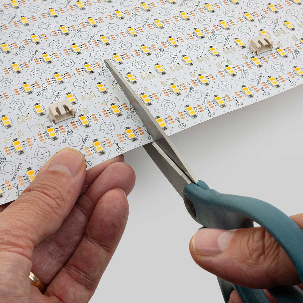 Cut marks on a flexible LED backlight sheet for installation planning
