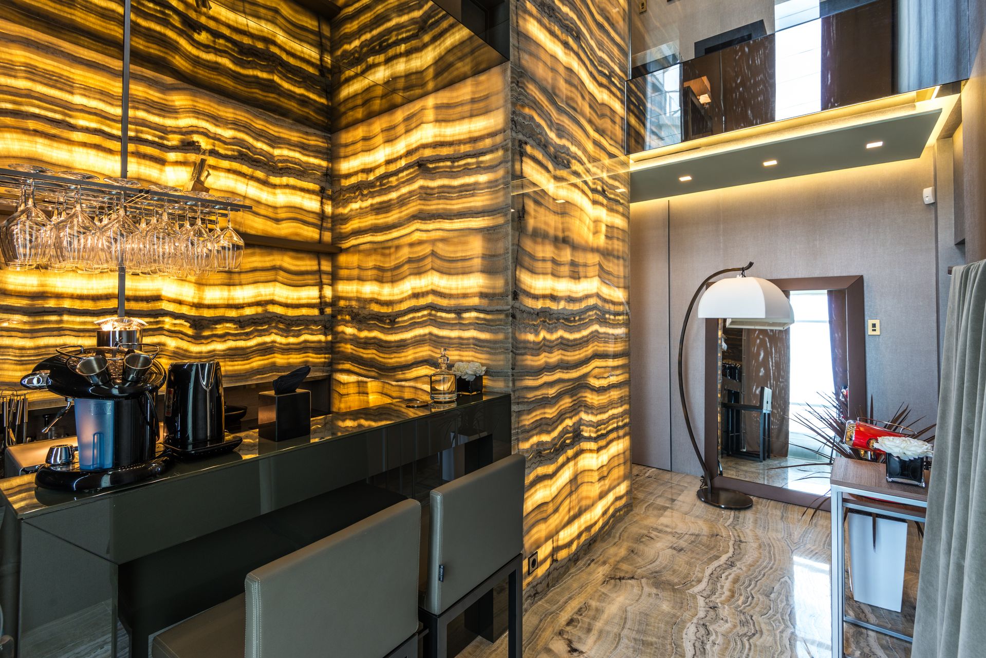 Backlit onyx wall illuminated by LED light sheets in an interior project